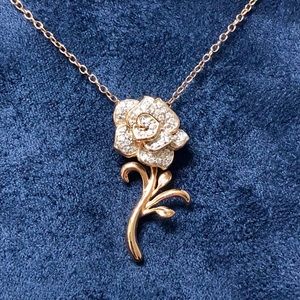 Diamond & 10kt Rose Gold rose pendant necklace.